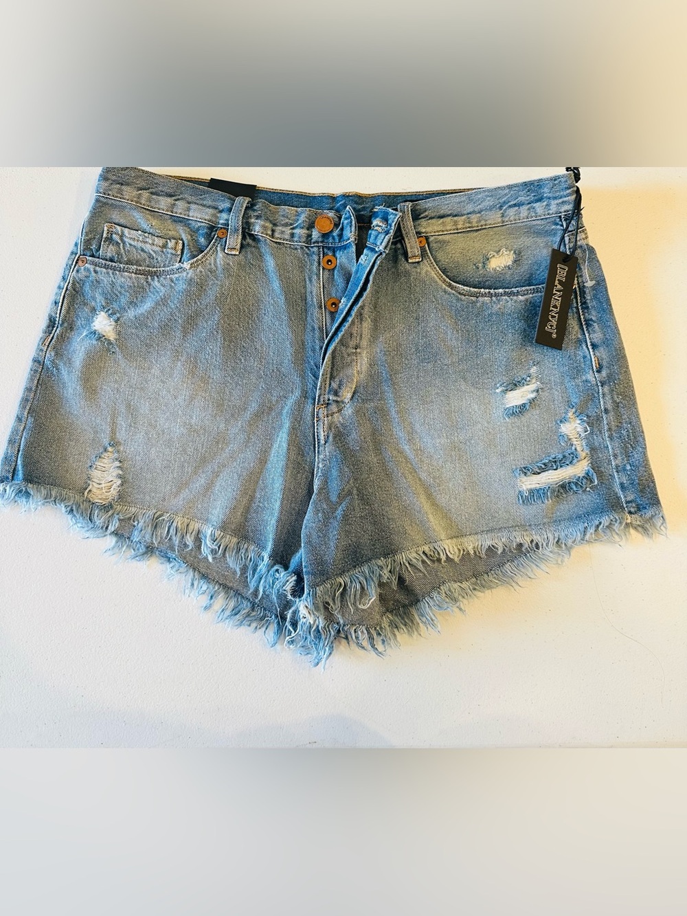 High-Rise Distressed Denim Shorts - Light Blue
New with tags